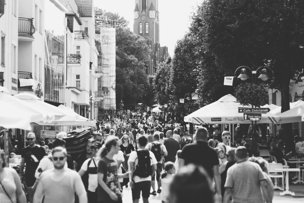 pexels-photo-1245055-1245055 A black and white photo capturing a busy street filled with people in Sopot, Poland during the day.